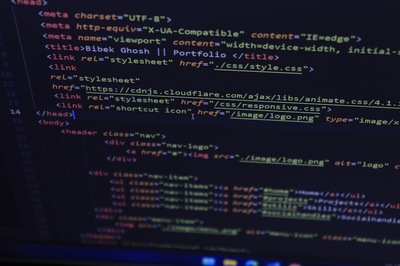 why-choose-us Close-up of HTML and CSS code displayed on a computer screen, ideal for tech and programming themes.
